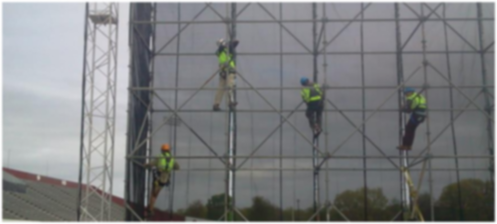 Background of Technicians climbing scaffolding